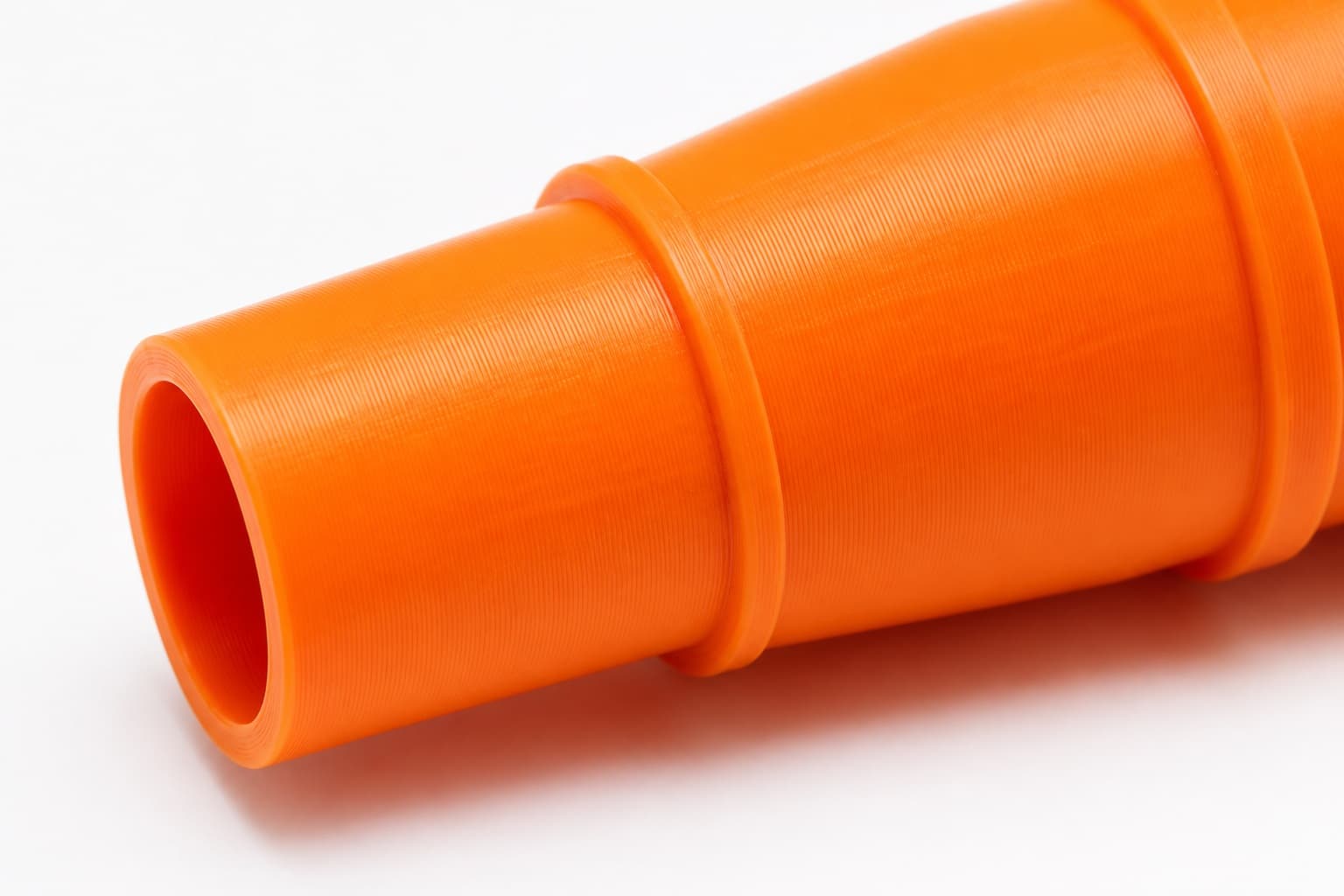 A close view of the dust adapter opening, about 31.75 mm across