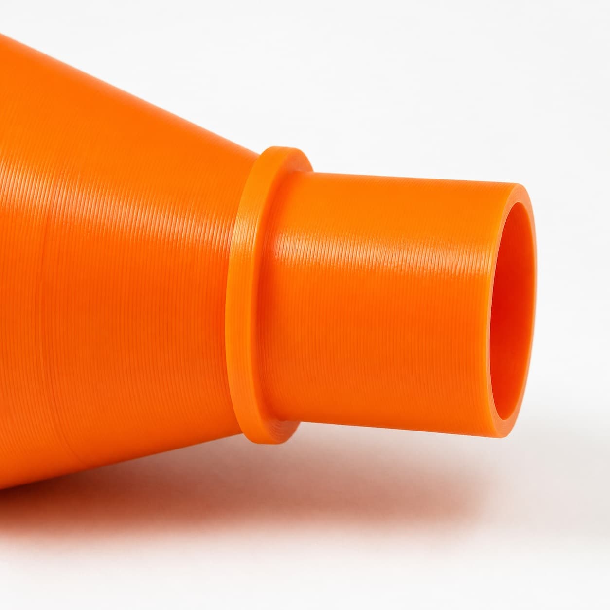 A close view of the dust adapter opening, about 35 mm across