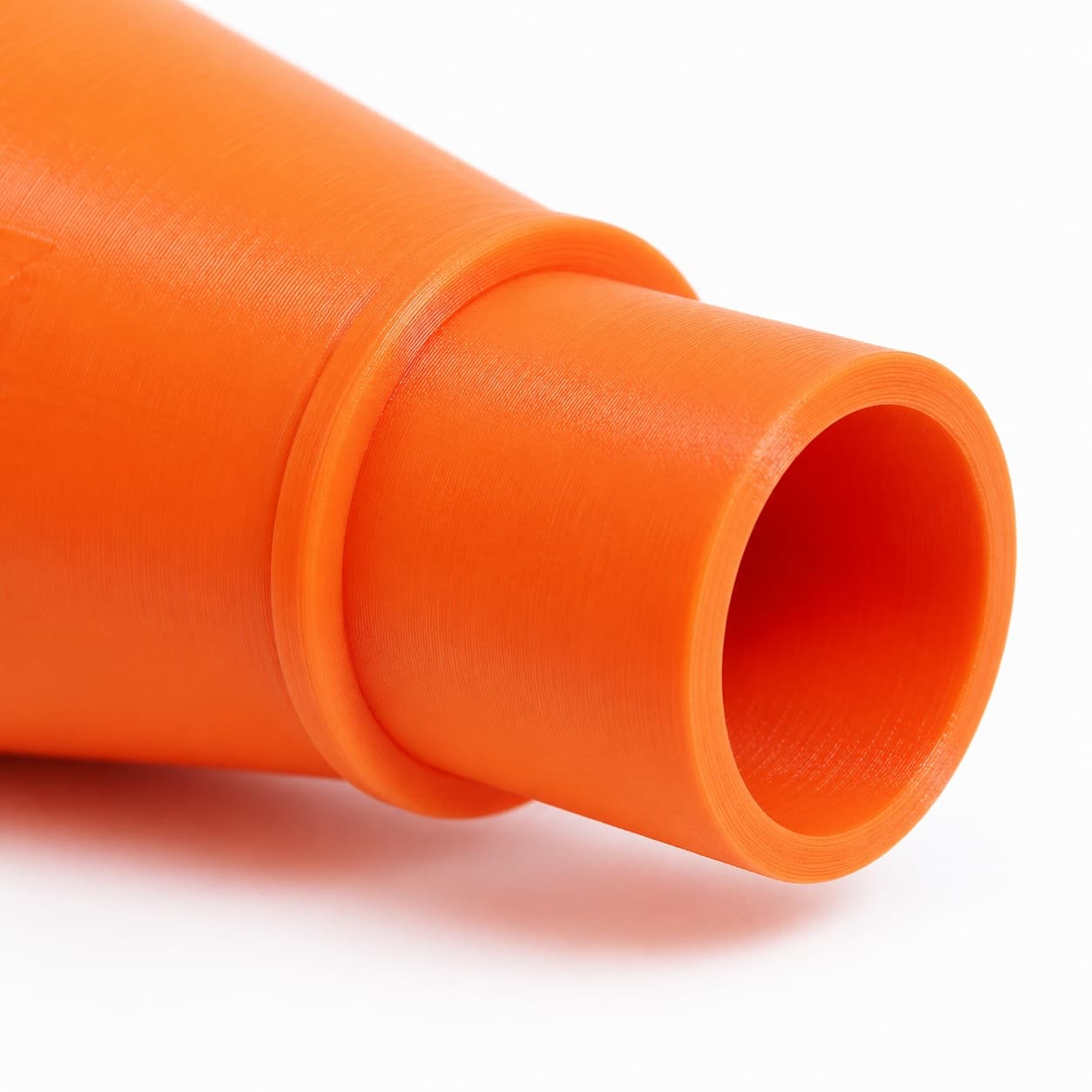 A close view of the dust adapter opening, about 31.75 mm across