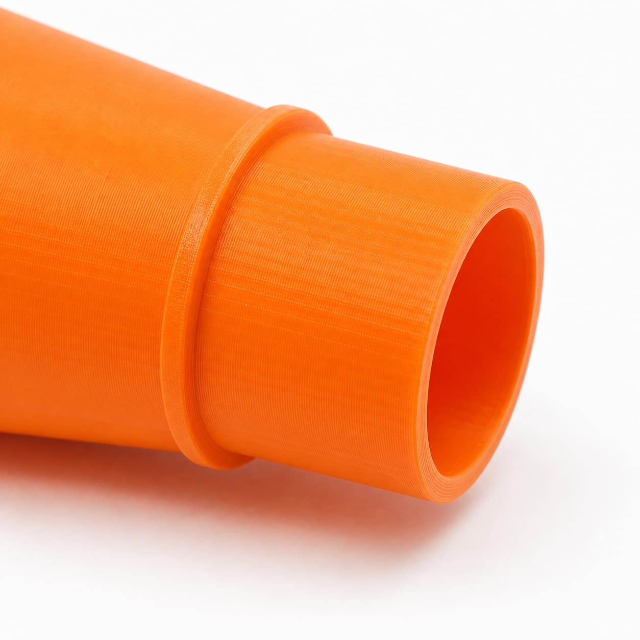 A close view of the dust adapter opening, about 63.5 mm across