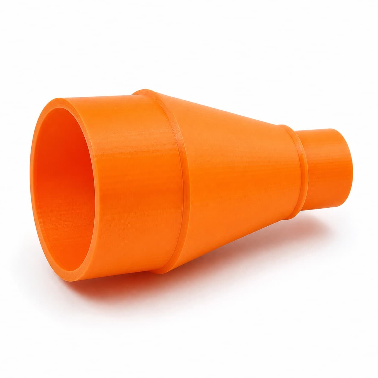 A printed dust adapter with a wide end and a narrow end, about 63.5 mm across the wide end