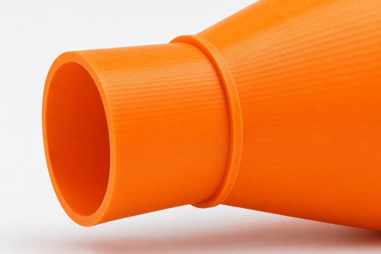 A close view of the dust adapter opening, about 101.6 mm across