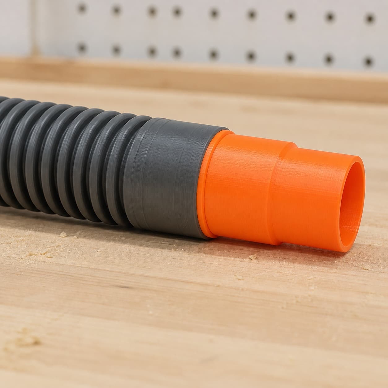 The MultiMaster dust adapter connected to a plain shop vac hose