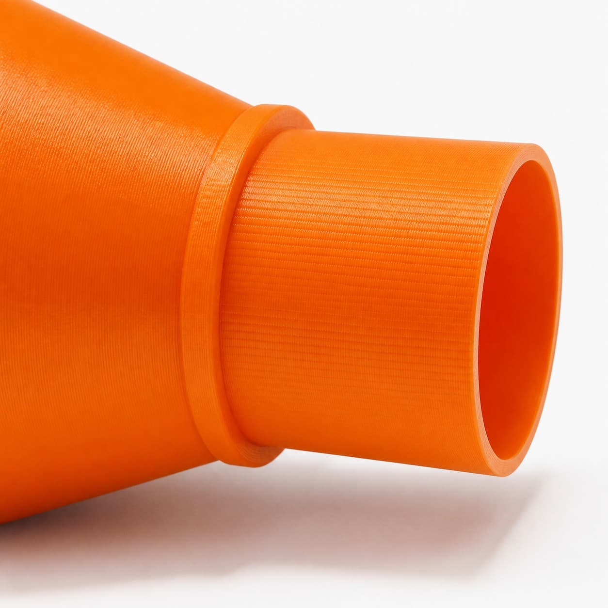 A close view of the dust adapter opening, about 63.5 mm across