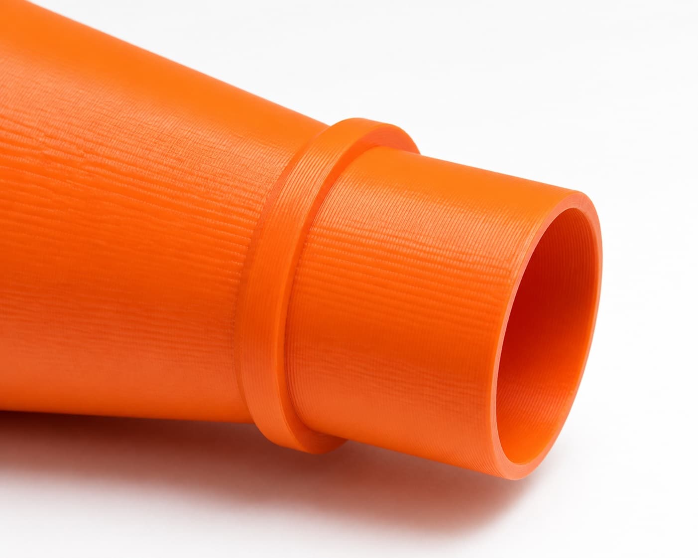 A close view of the dust adapter opening, about 101.6 mm across