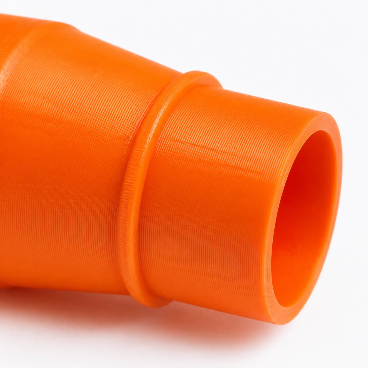 A close view of the dust adapter opening, about 31.75 mm across