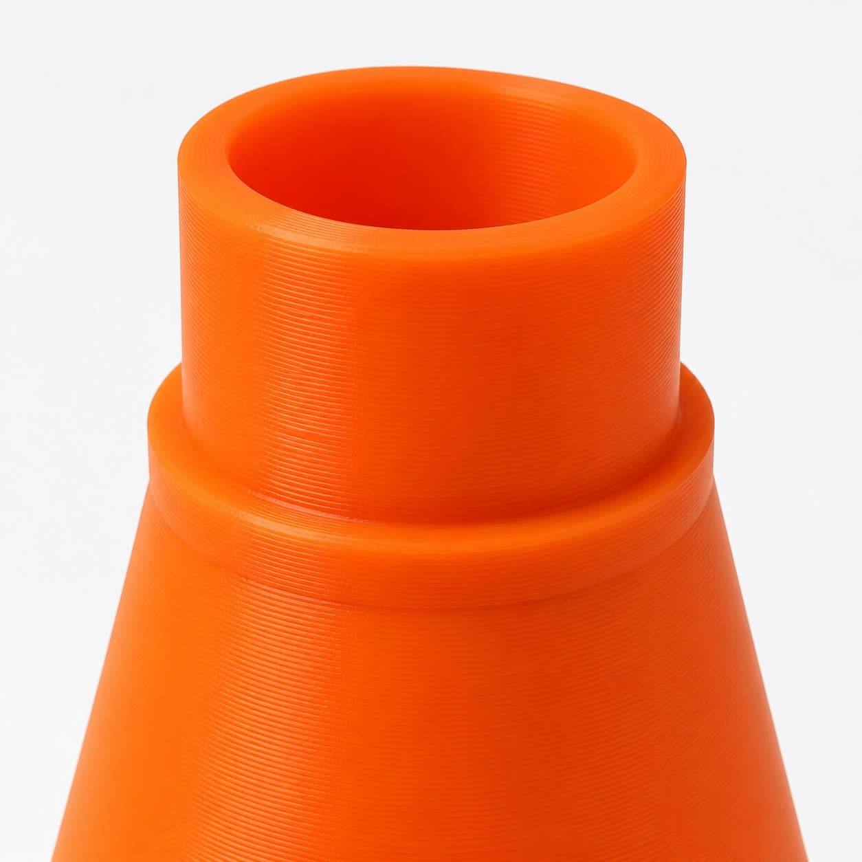 A close view of the dust adapter opening, about 31.75 mm across