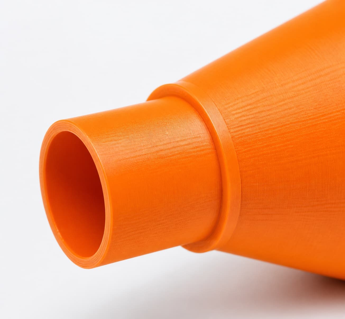 A close view of the dust adapter opening, about 27 mm across