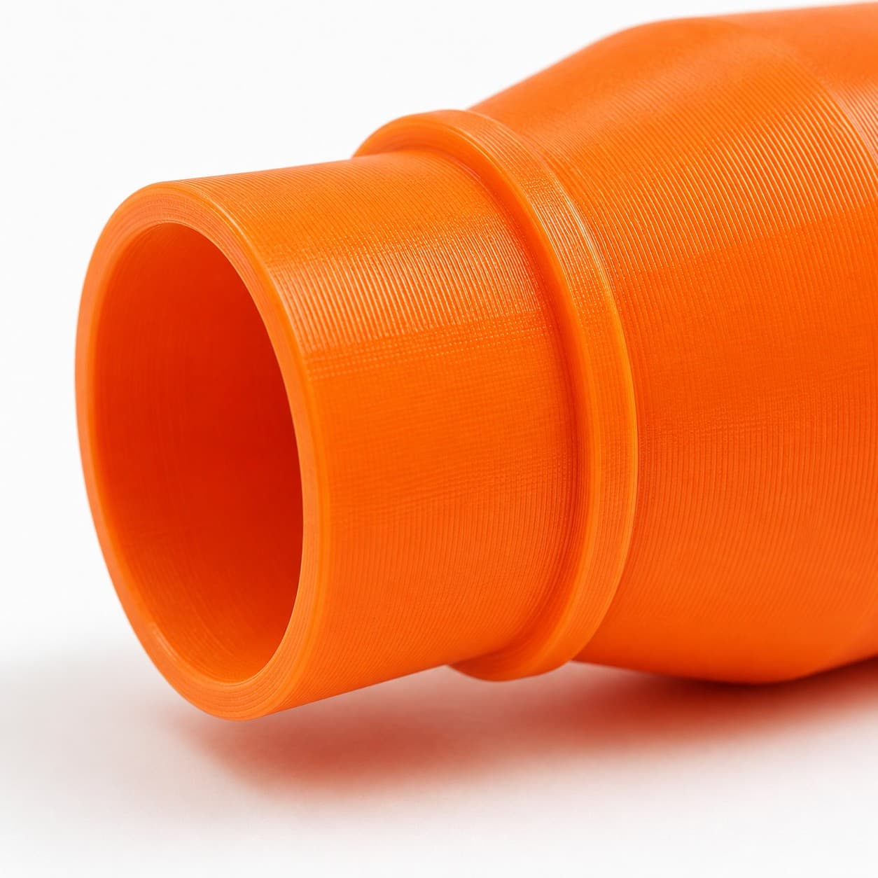 A close view of the dust adapter opening, about 31.75 mm across