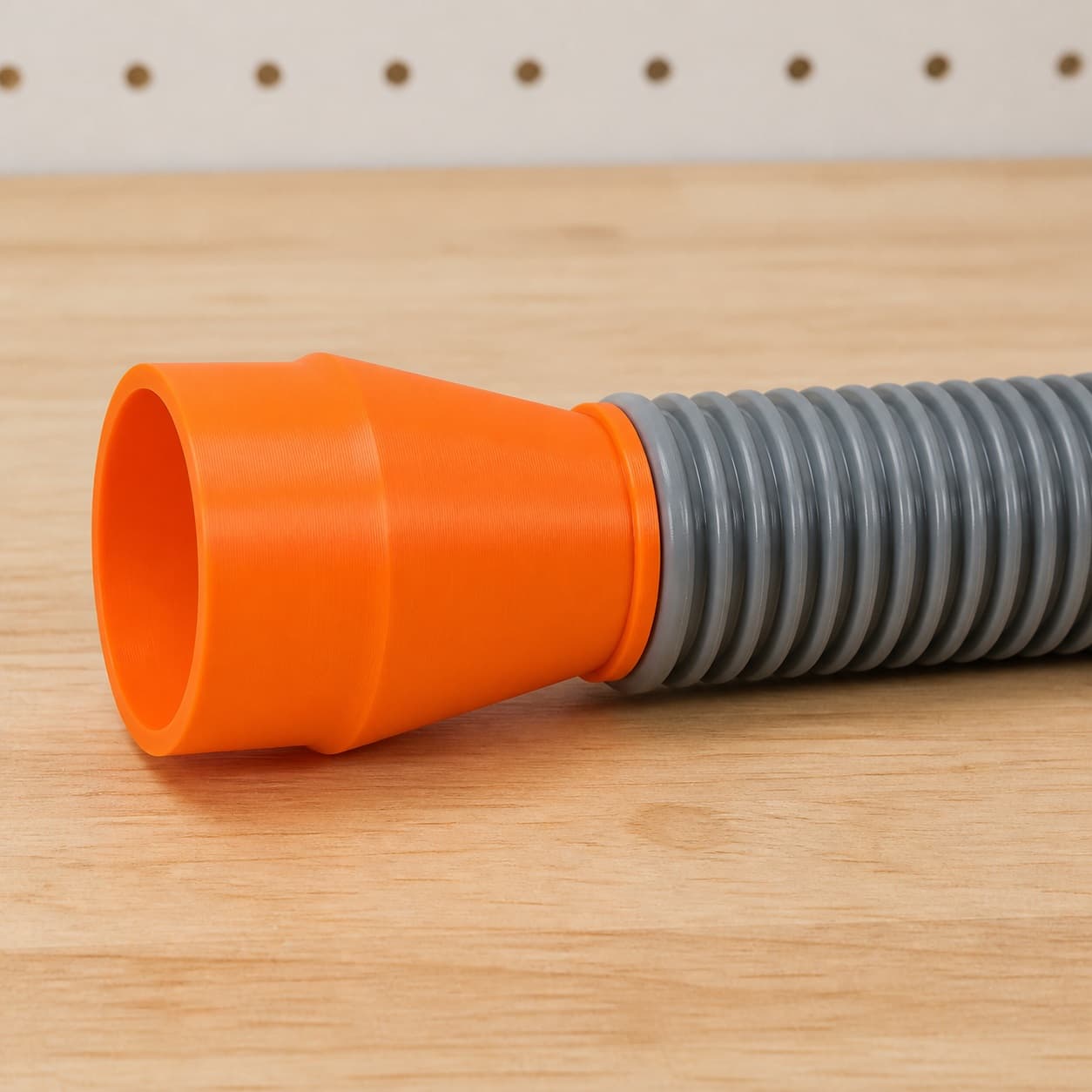 The CMXETAX dust adapter connected to a plain shop vac hose
