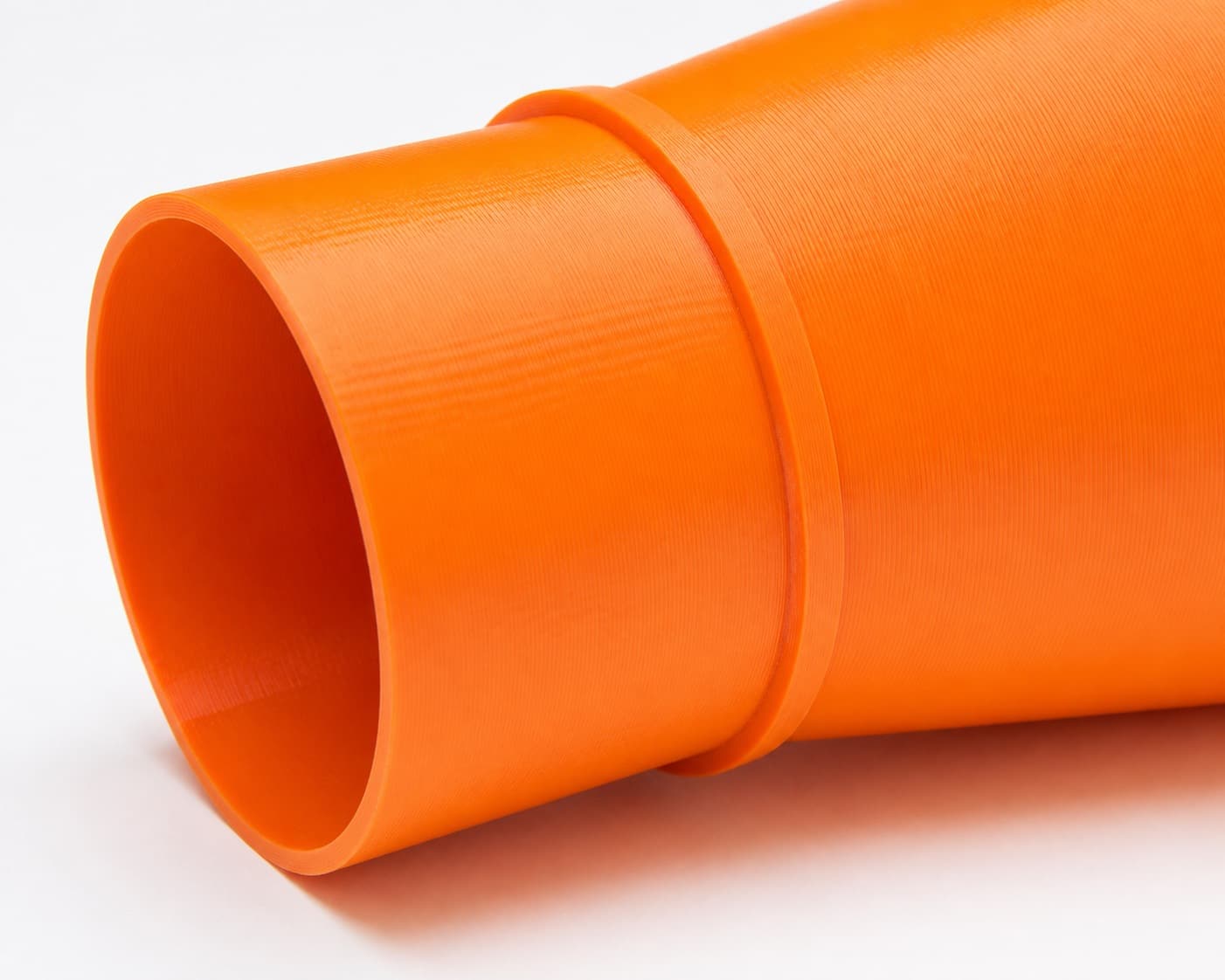 A close view of the dust adapter opening, about 31.75 mm across